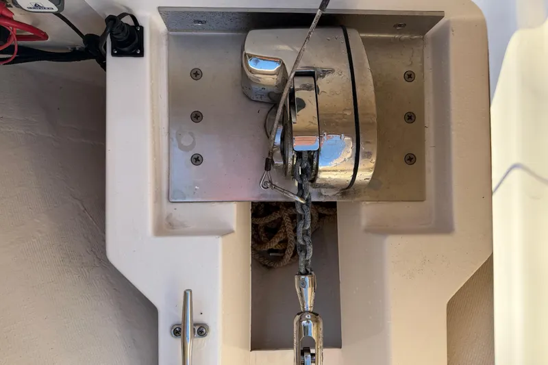 Slide: The Image of Anchor winch on 2017 Pursuit DC 295 Dual Console boat, featuring stainless steel components. - 49