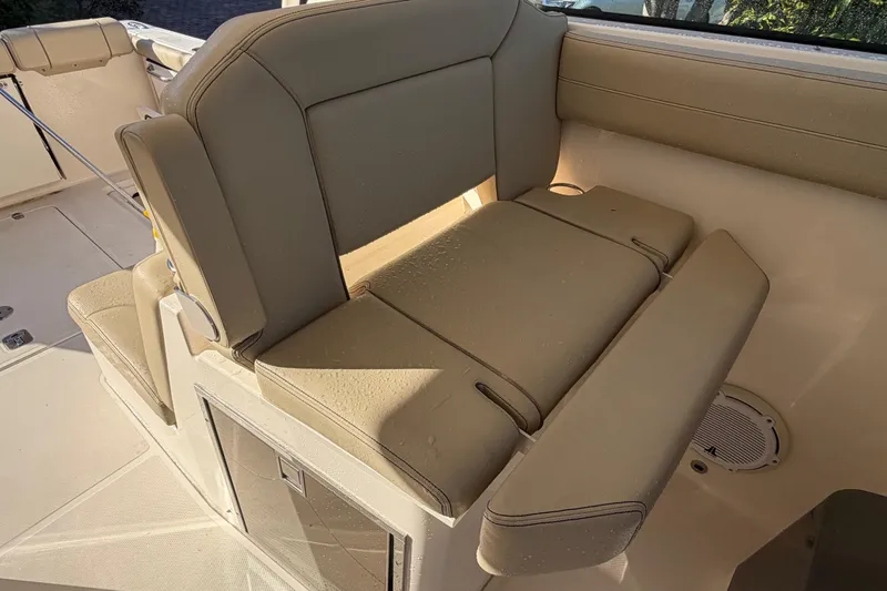 Slide: The Image of 2017 Pursuit DC 295 Dual Console boat interior seating with beige upholstery. - 58