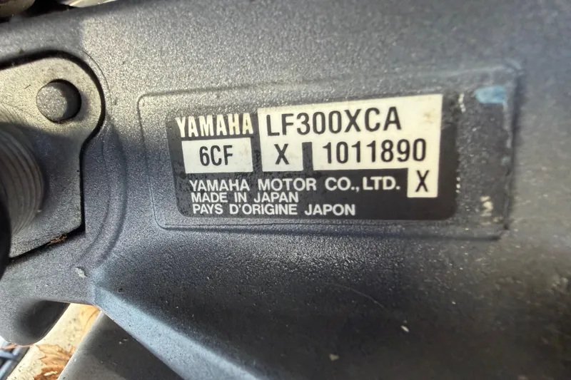 Slide: The Image of Yamaha LF300XCA engine label on 2017 Pursuit DC 295 Dual Console boat. - 69
