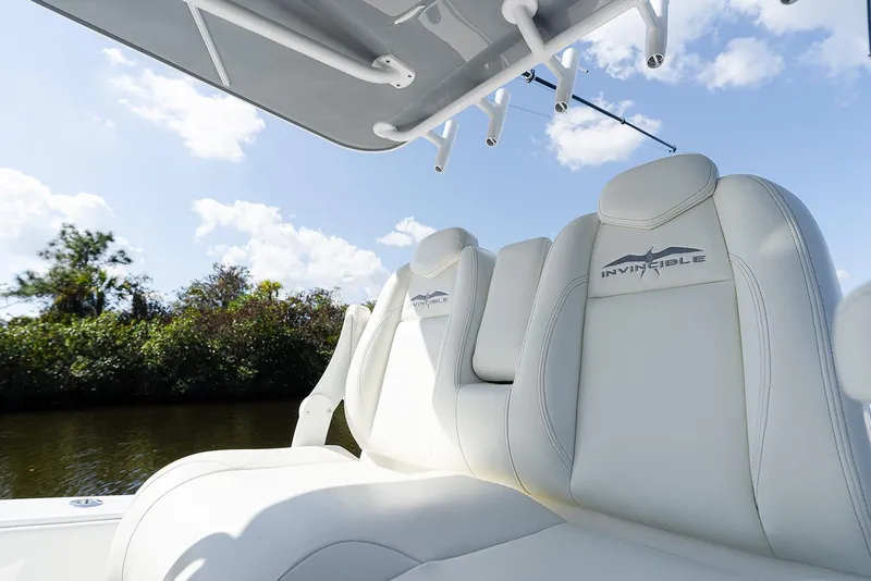 Slide: The Image of 2024 Invincible 33 Open Fisherman boat seats under clear sky. - 14