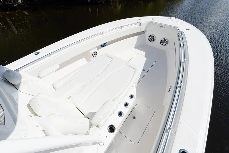 Slide: The Image of 2024 Invincible 33 Open Fisherman boat with spacious seating and sleek design on calm water. - 16