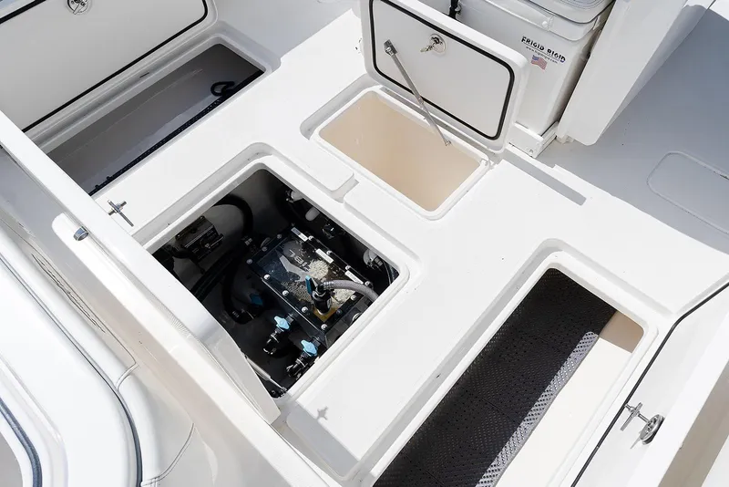 Slide: The Image of 2024 Invincible 33 Open Fisherman boat deck with storage compartments and equipment. - 30