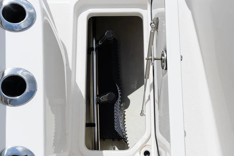 Slide: The Image of Open storage compartment on 2024 Invincible 33 Open Fisherman boat. - 35