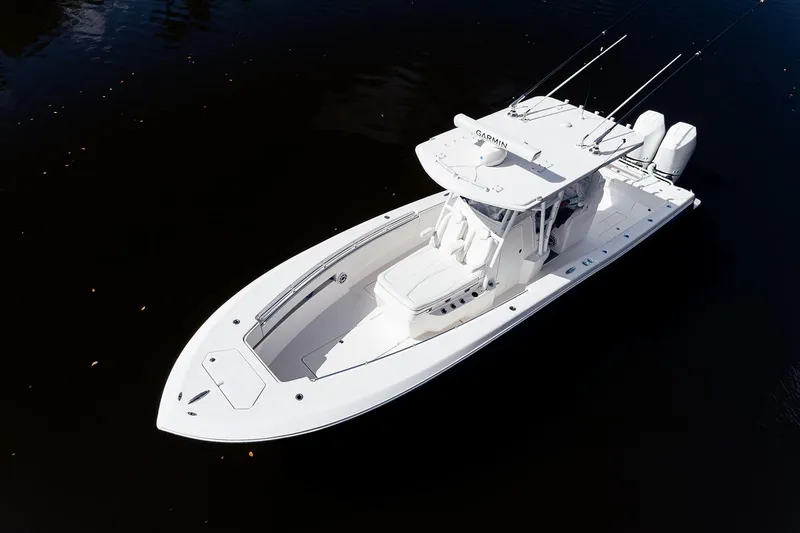 Slide: The Image of 2024 Invincible 33 Open Fisherman boat on calm water, aerial view. - 8