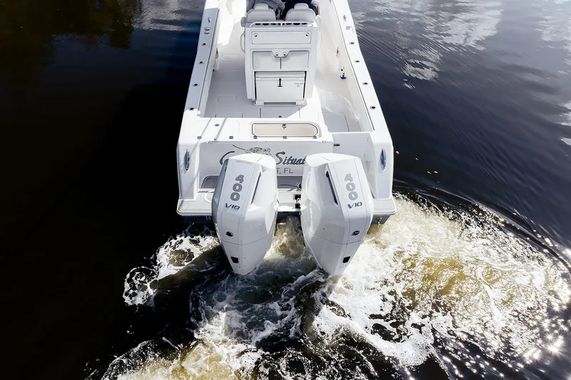 Slide: The Image of 2024 Invincible 33 Open Fisherman with dual 400 V10 engines on water. - 9