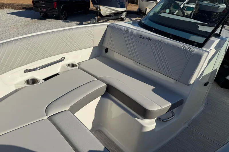 Slide: The Image of 2026 Sea Ray SDX 230 boat interior with gray seating and cup holders. - 7