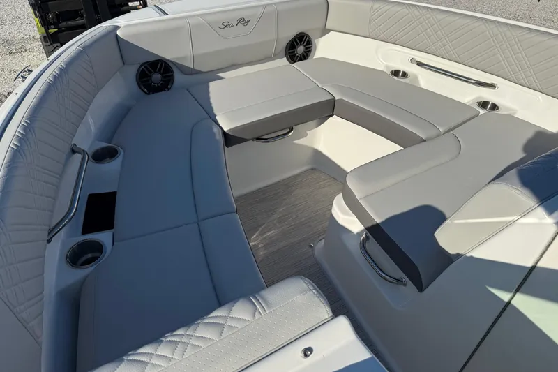 Slide: The Image of 2026 Sea Ray SDX 230 boat interior with gray seating and cup holders. - 8