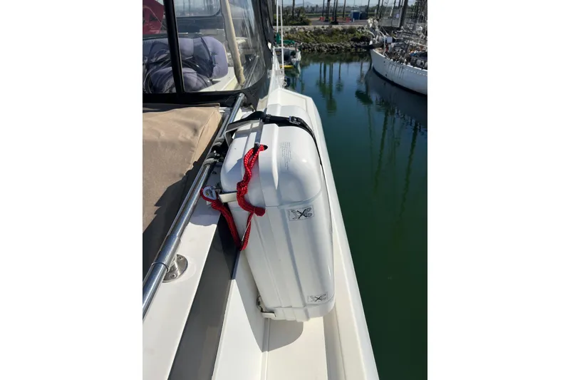 Slide: The Image of Flybridge enclosure and seating, table, and marina view. - 15