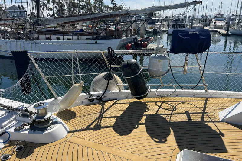 Slide: The Image of 1991 Viking 63 Motor Yacht docked, rear view with "Kailani" name visible. - 2