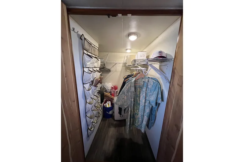 Slide: The Image of Luxurious interior of a 1991 Viking 63 Motor Yacht with elegant wood finishes and modern amenities. - 33