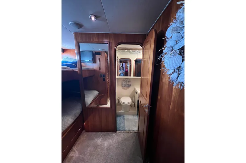 Slide: The Image of Full berth to Port with shared shower/head. - 45