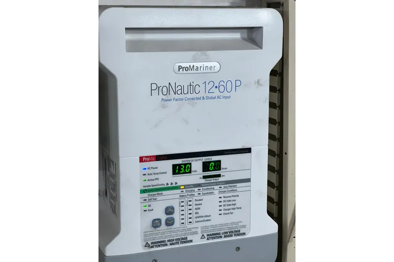 Slide: The Image of Engine room of 1991 Viking 63 Motor Yacht with equipment and wiring. - 56