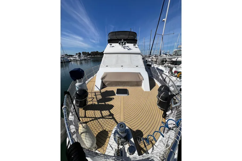 Slide: The Image of Bow of 1991 Viking 63 Motor Yacht with anchor winch and safety netting. - 6