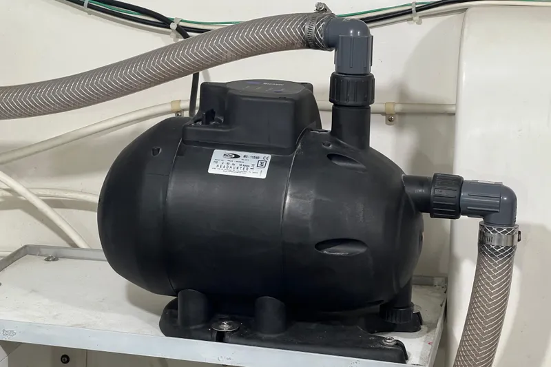 Slide: The Image of MACH 5 water pump and accumulator tank wth alternative 12v water pump - 63