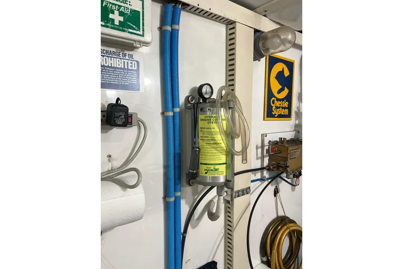 Slide: The Image of aft engine room wall with throttle controls and hydrolic cylinders - 66