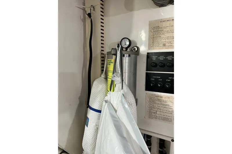 Slide: The Image of aft engine room wall with throttle controls and hydrolic cylinders - 67