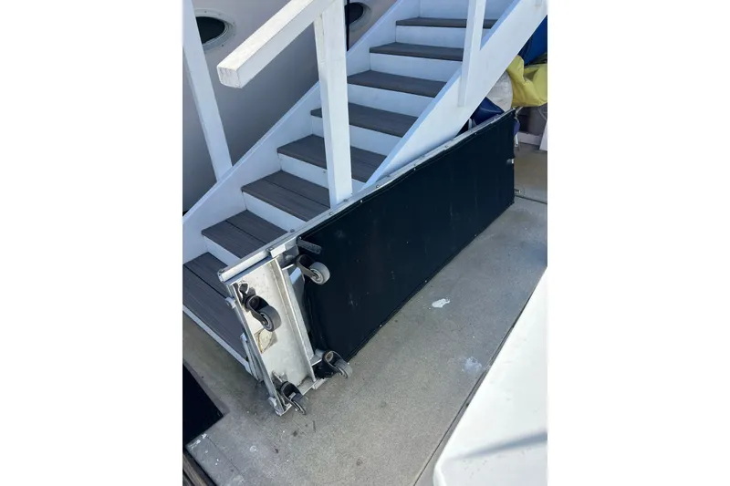 Slide: The Image of Stairway on 1991 Viking 63 Motor Yacht docked at marina. - 75