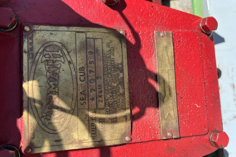 Slide: The Image of Vintage 1938 yacht tender engine plate with "Wermath" branding and serial number details. - 12