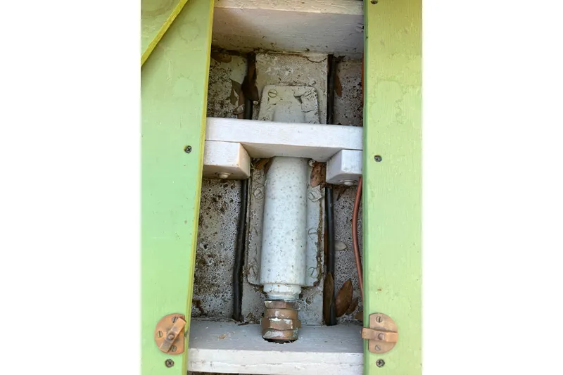 Slide: The Image of 1938 Yacht Tender component with green framing and visible metal parts. - 14