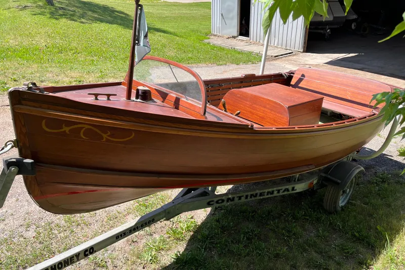Slide: The Image of 1938 wooden yacht tender on trailer, showcasing elegant craftsmanship and vintage design. - 3