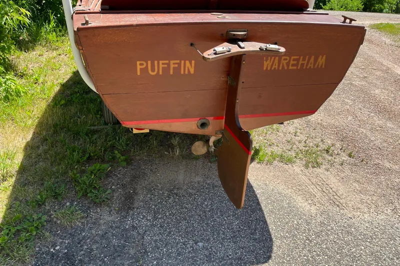 Slide: The Image of Rear view of 1938 wooden yacht tender "Puffin" with rudder, on gravel path. - 5
