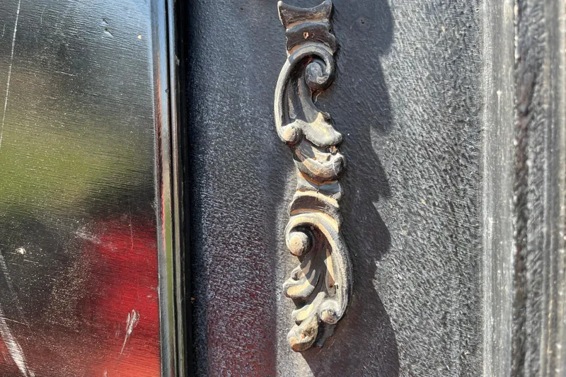 Slide: The Image of Ornate metal handle on vintage 1985 GONDOLA utility door. - 12