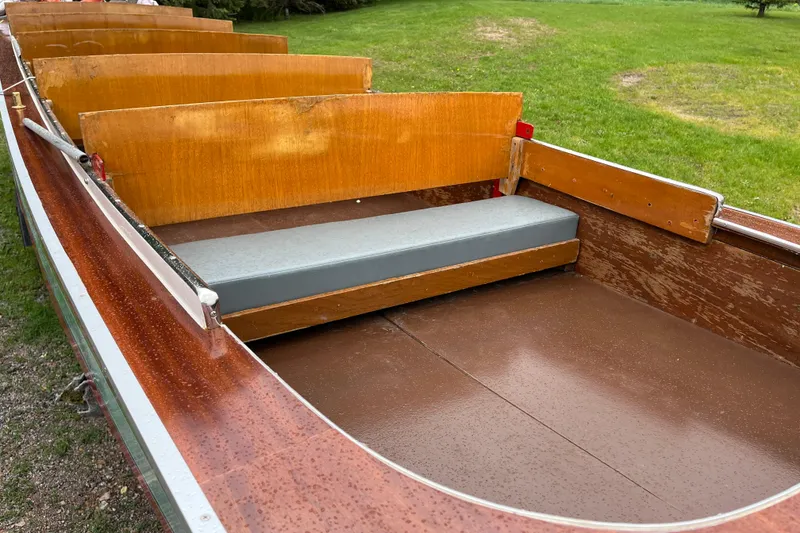 Slide: The Image of 1990 Thai Longboat utility model with wooden seats and a gray cushion. - 3