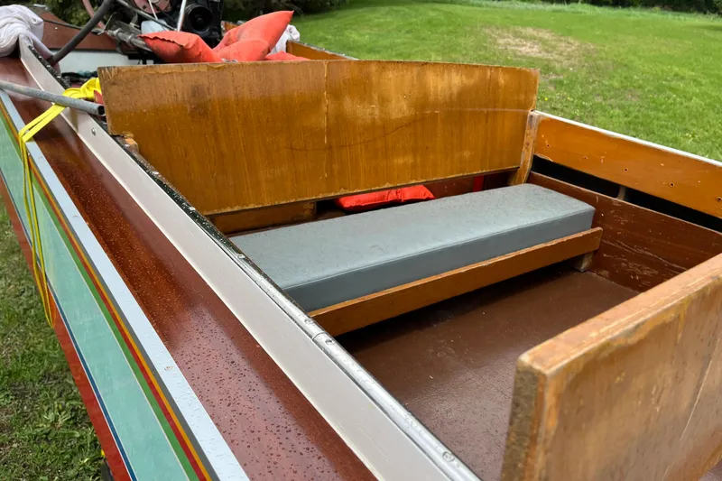 Slide: The Image of 1990 Thai Longboat utility model with wooden seating and colorful exterior design. - 7
