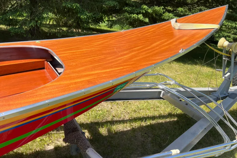 Slide: The Image of 1990 Utility Series Thai Longboat with polished wooden deck on a trailer. - 5