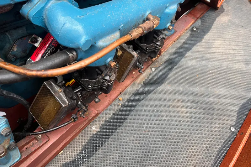 Slide: The Image of 1956 Chris-Craft 17 Sportsman engine detail with blue components and wiring. - 11