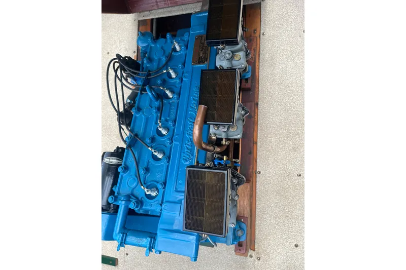 Slide: The Image of 1955 Chris-Craft 17 Sportsman engine, vibrant blue, detailed view. - 13