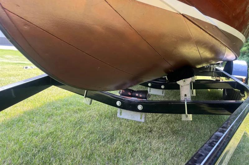 Slide: The Image of 1955 Chris-Craft 17 Sportsman boat on trailer, showing underside and hull details. - 18