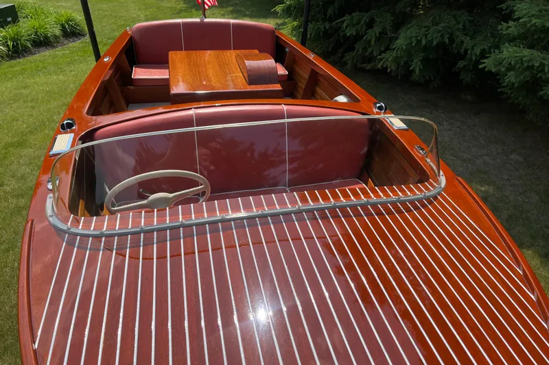 Slide: The Image of 1955 Chris-Craft 17 Sportsman boat with polished wood finish and red interior. - 8