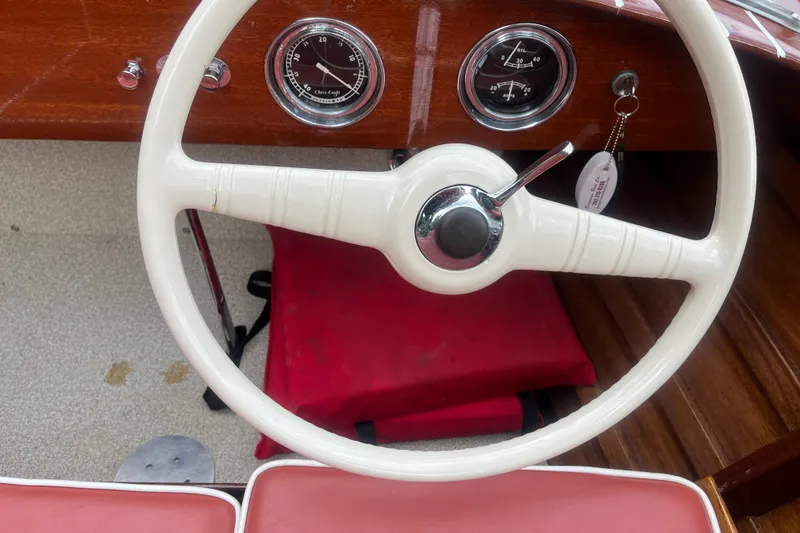 Slide: The Image of 1955 Chris-Craft 17 Sportsman steering wheel and dashboard with vintage gauges. - 9