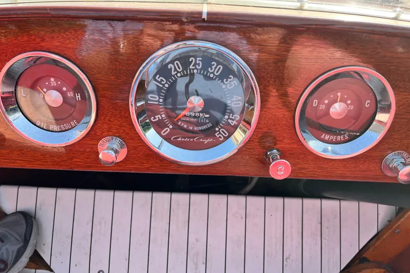Slide: The Image of 1958 Chris-Craft 16 Cavalier dashboard with oil pressure, RPM, and amperes gauges. - 13