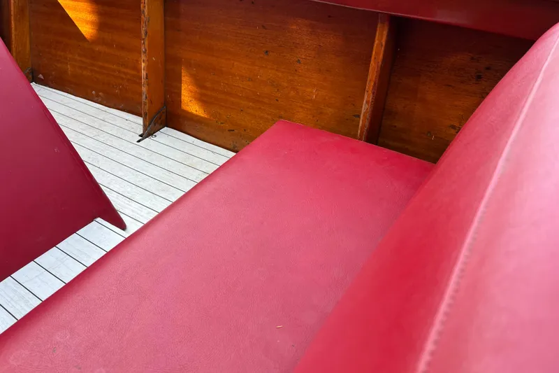 Slide: The Image of 1958 Chris-Craft 16 Cavalier interior with red seats and wooden accents. - 17