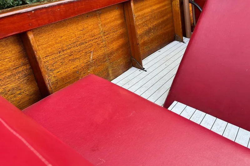 Slide: The Image of 1958 Chris-Craft 16 Cavalier interior with red seats and wooden paneling. - 18