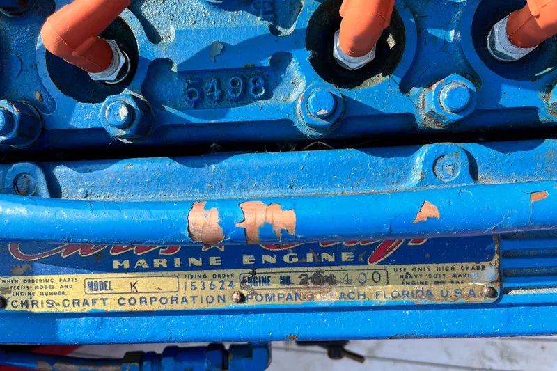 Slide: The Image of 1958 Chris-Craft 16 Cavalier marine engine with blue paint and visible model plate. - 6