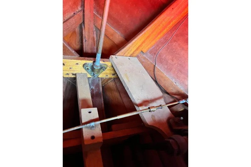 Slide: The Image of 1958 Chris-Craft 16 Cavalier interior, showcasing wooden structure and mechanical components. - 9