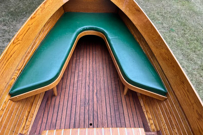 Slide: The Image of Wooden boat interior with green cushioned seating, 1908 Outing launch model. - 10