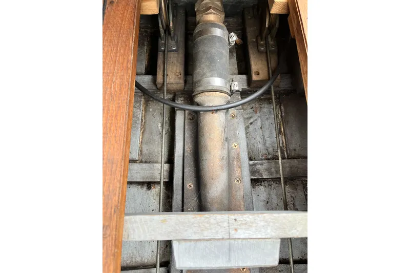 Slide: The Image of Close-up of 1908 Outing launch engine component with wooden and metal elements. - 11