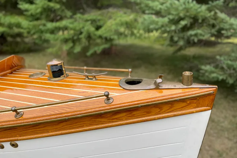Slide: The Image of Vintage 1908 Outing launch boat with polished wood and brass details. - 5