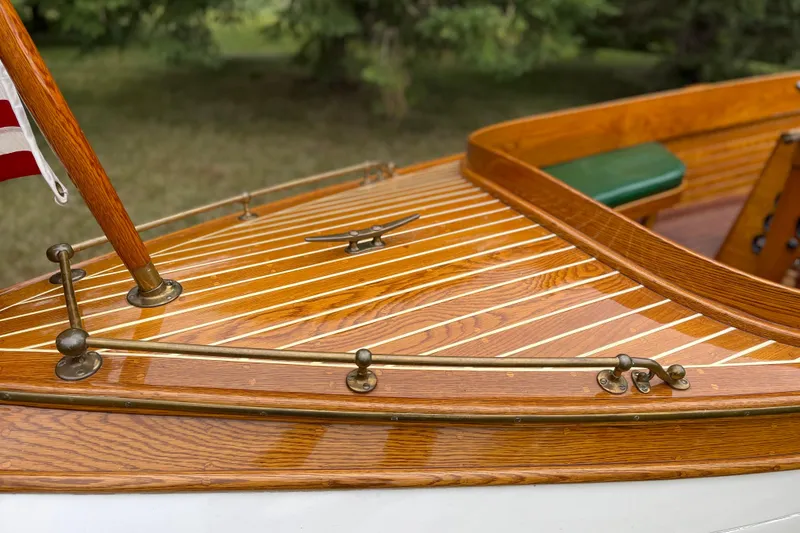Slide: The Image of Vintage 1908 Outing launch boat with polished wooden deck and brass fittings. - 6