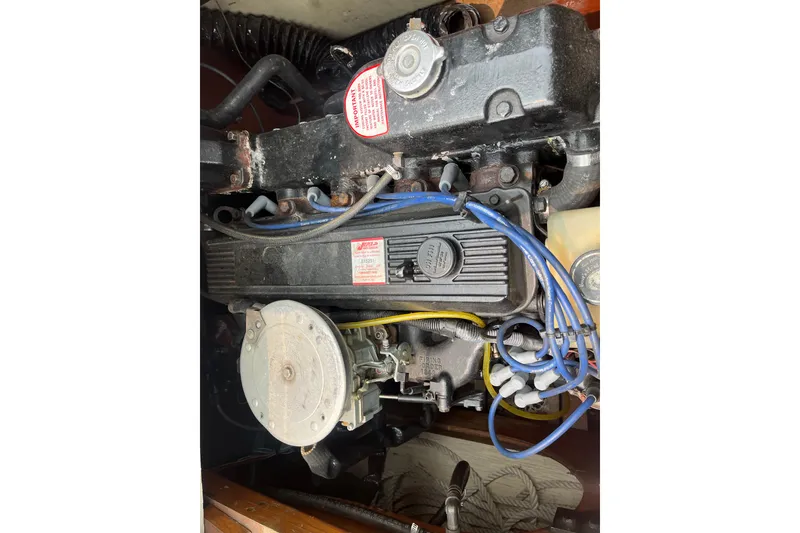 Slide: The Image of Engine of a 1979 Skiff Craft 24 Flybridge with visible wiring and components. - 16