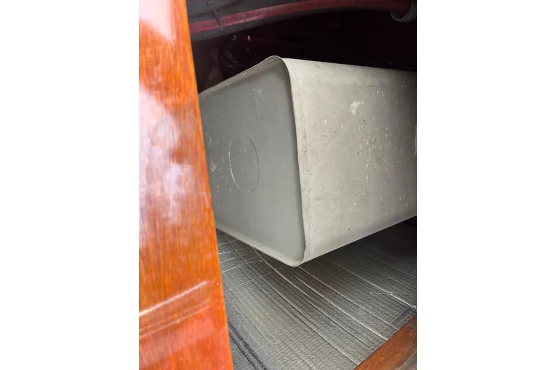 Slide: The Image of 1979 Skiff Craft 24 Flybridge interior detail showing storage compartment. - 17