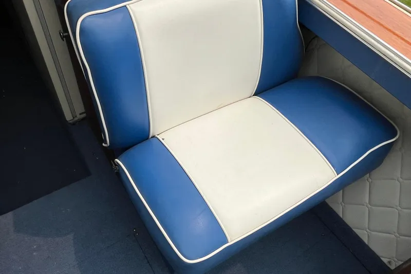 Slide: The Image of Blue and white seat on 1979 Skiff Craft 24 Flybridge boat. - 29