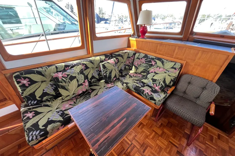 Slide: The Image of Interior of 1978 Marine Trader 40 with floral upholstery and wooden accents. - 18