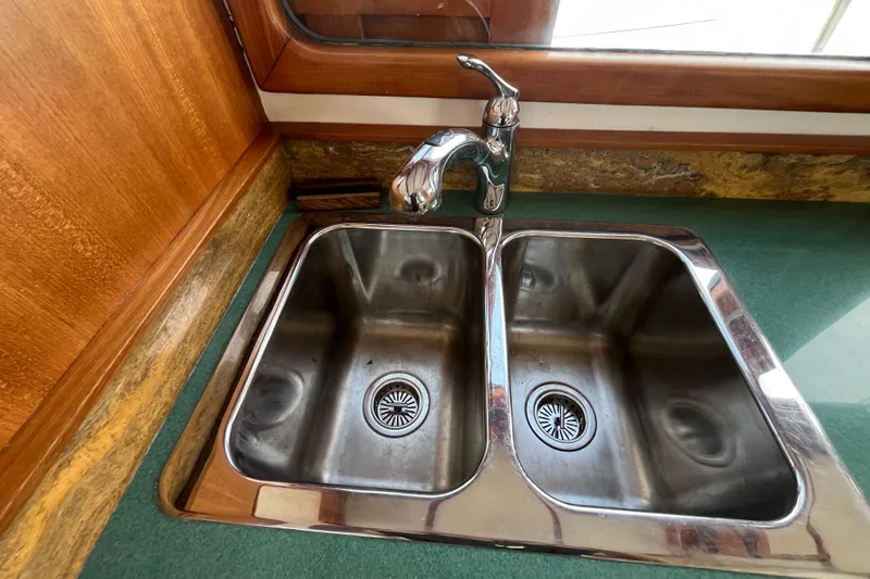 Slide: The Image of Stainless steel double sink in 1978 Marine Trader 40 yacht kitchen. - 20