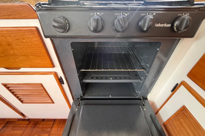 Slide: The Image of 1978 Marine Trader 40 yacht kitchen with Suburban oven and wooden cabinetry. - 22