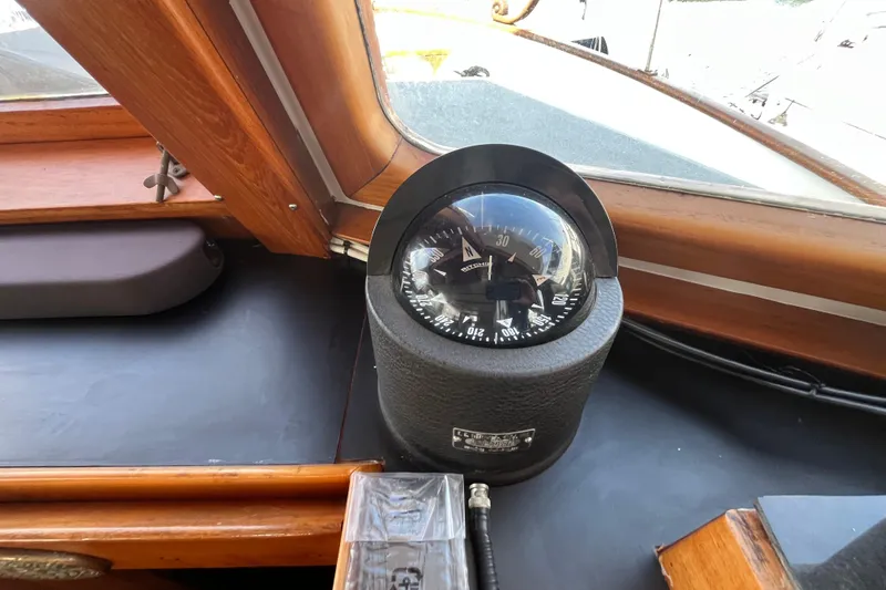 Slide: The Image of Compass on 1978 Marine Trader 40 boat dashboard, showcasing classic nautical design. - 40